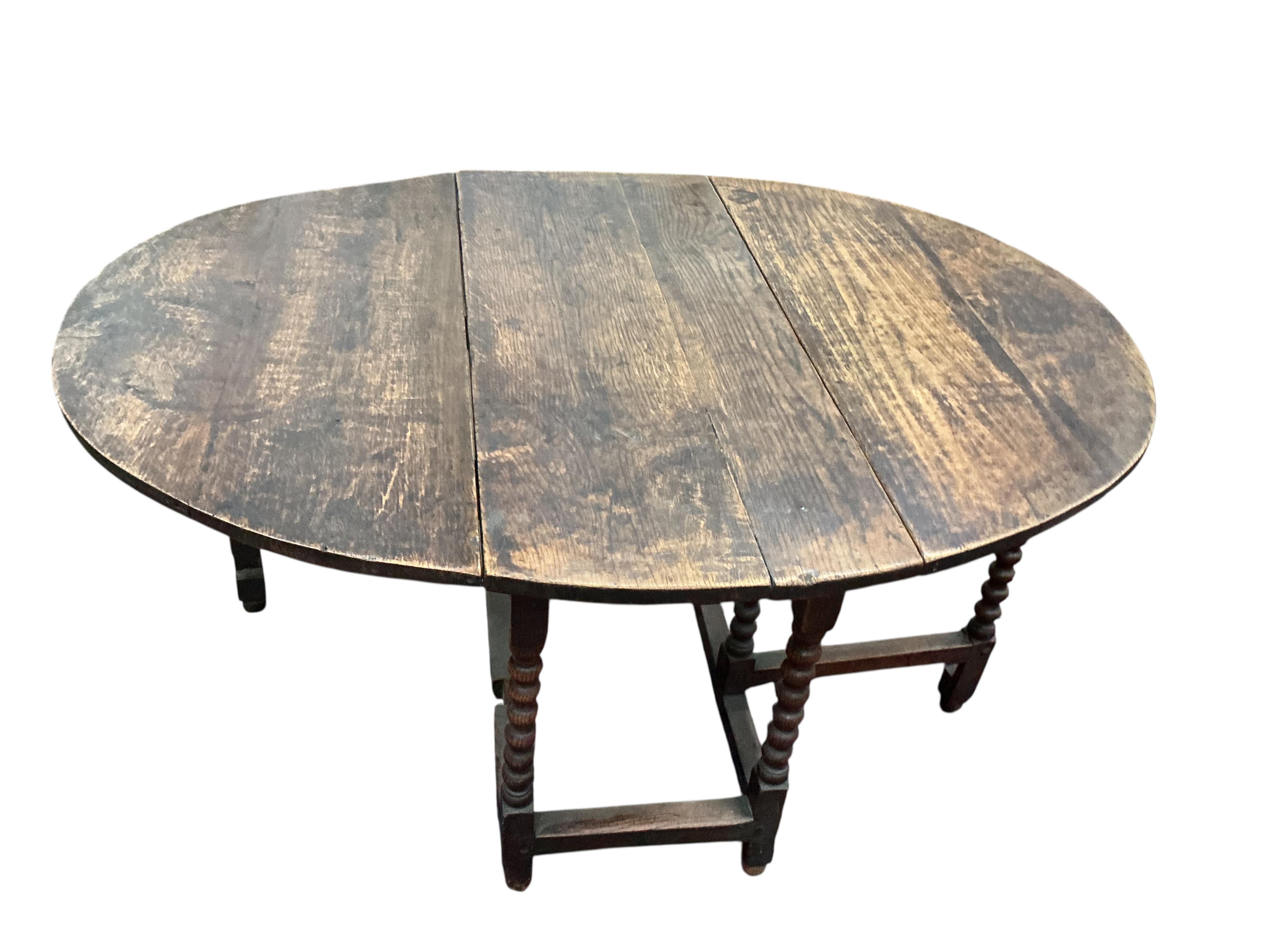 An oak gate leg table, width 120cm, depth 53cm, height 74cm